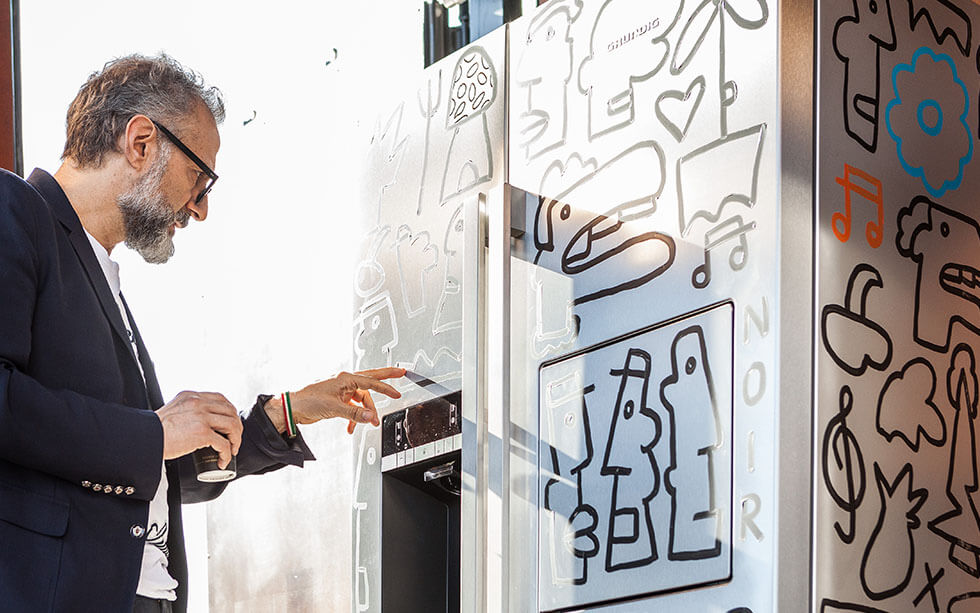 Massimo Bottura looking at Face a Fridge artwork